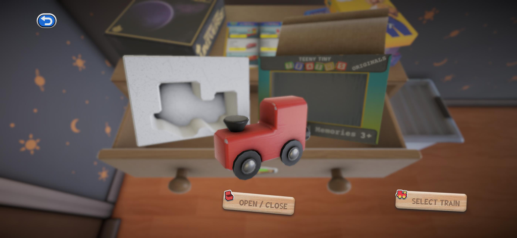 Teeny Tiny Trains - Un piccolo trenino giocattolo rosso in legno e la sua confezione all'interno di un cassetto di legno