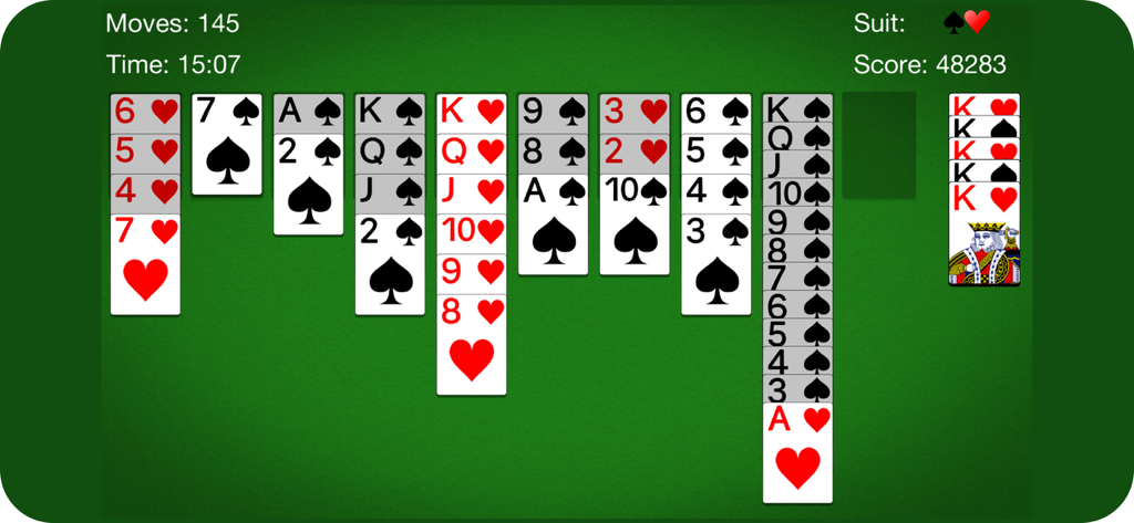 Spider Solitaire gameplay showing card piles on a classic green background