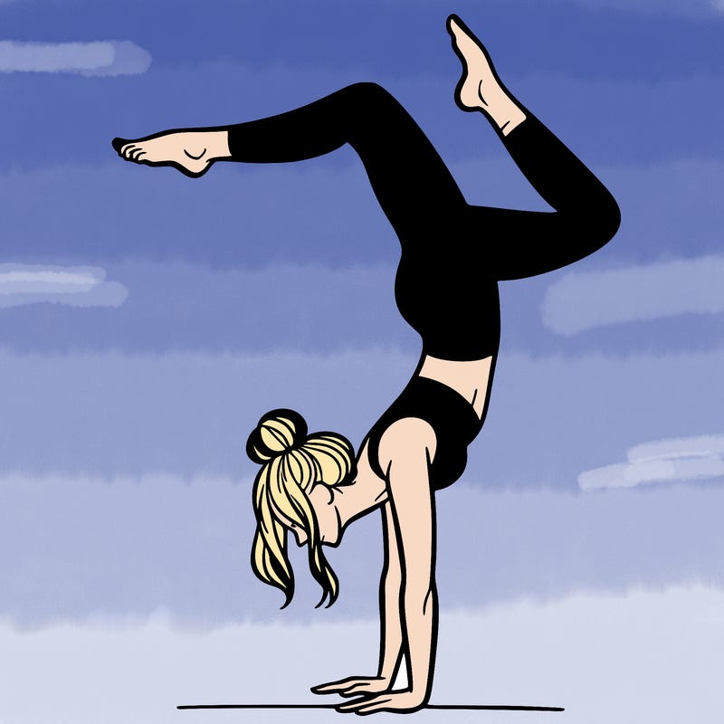 a woman doing a handstand