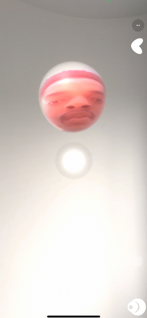 BOCLAA app screen displaying face tracking technology on a floating sphere in an AR music environment