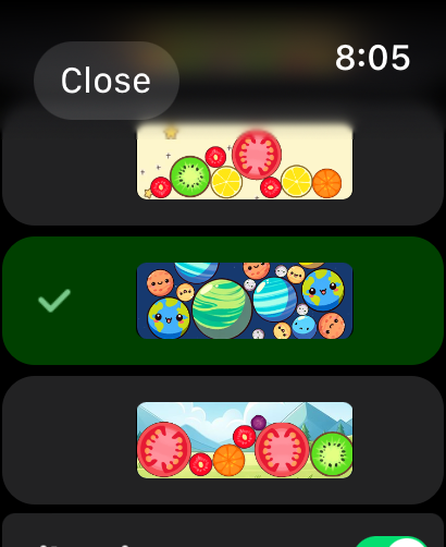 Merge Watermelon for watch - A selection menu on an Apple Watch showing different game themes including fruits and cute planets for a merge puzzle game.