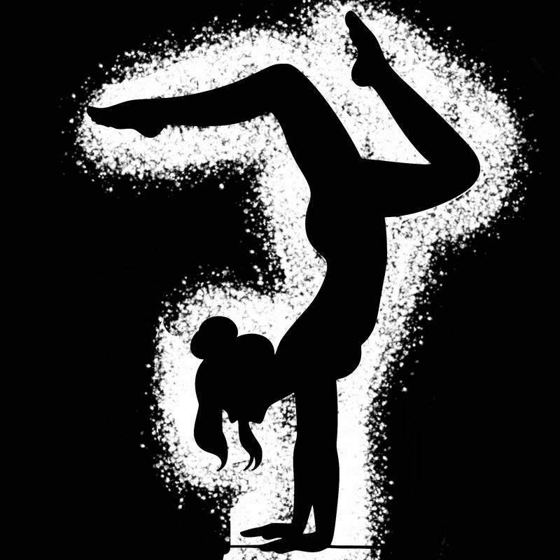 a woman doing a handstand