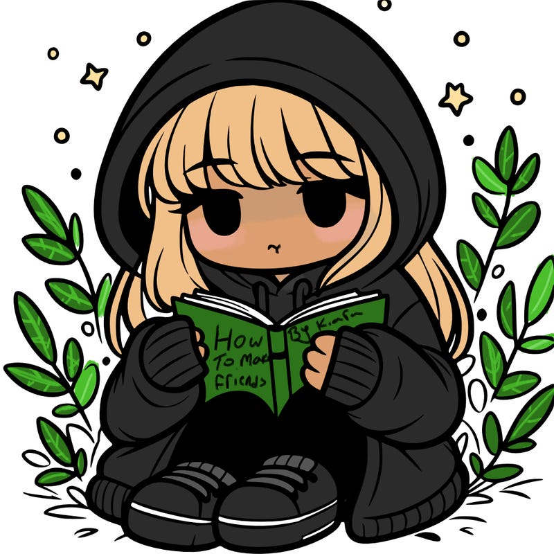 girl in oversized hoodie reading a book