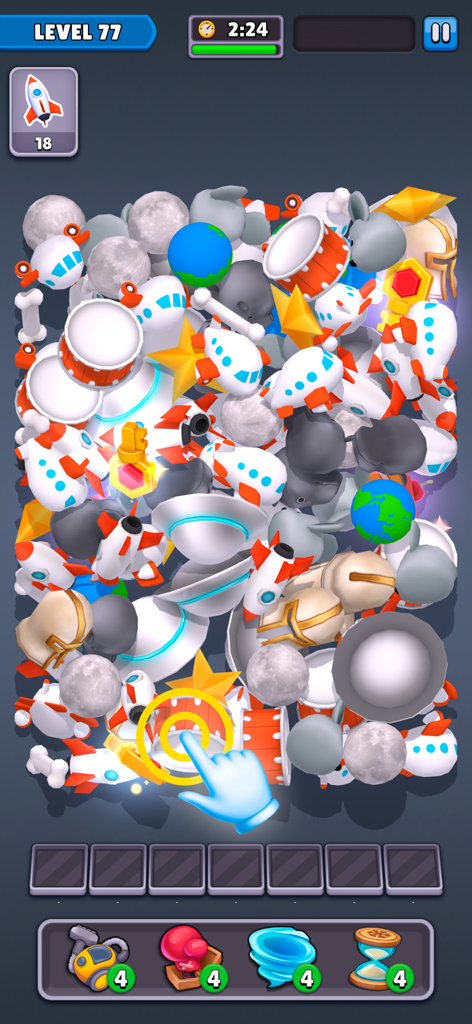 Match Junk: Triple Tile Puzzle - Gameplay screenshot of Match Junk showing a pile of 3D objects including planets and rockets for triple tile matching.