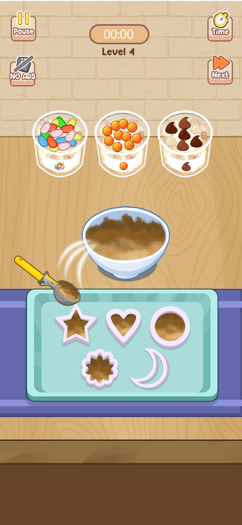 ASMR Chef Cozy Kitchen Cooking - Una pantalla de minijuego de cocina que muestra masa siendo recogida en varias formas de cortadores de galletas en una bandeja.