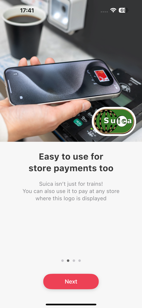 Welcome Suica Mobile - A hand using an iPhone for contactless store payments with the Welcome Suica Mobile app
