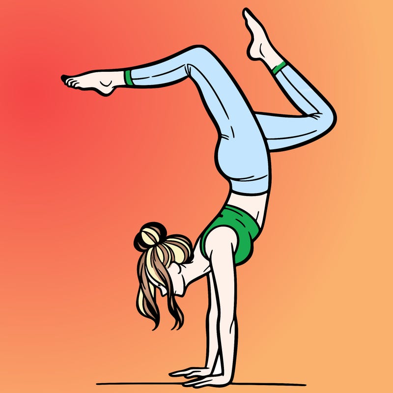 a woman doing a handstand