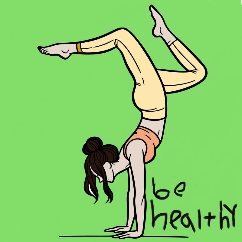 a woman doing a handstand