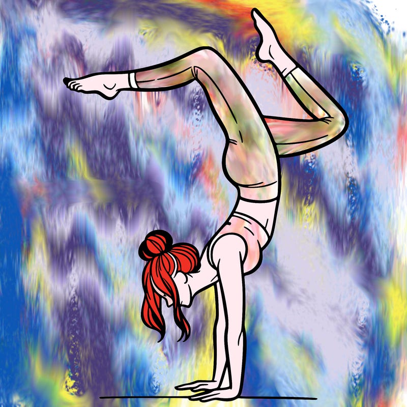 a woman doing a handstand