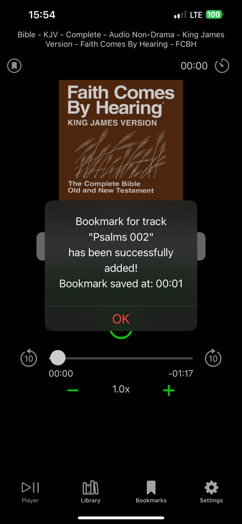 Player for Audiobooks & Music - Un mensaje de confirmación de marcador en la pantalla de reproducción de la aplicación BookPlayer Pro mientras se reproduce un audiolibro de la Biblia.