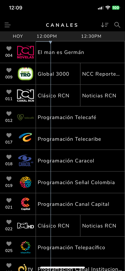 WAVE - Interface de l'application WAVE montrant un guide des chaînes TV en direct avec divers programmes télévisés en langue espagnole et logos de réseaux