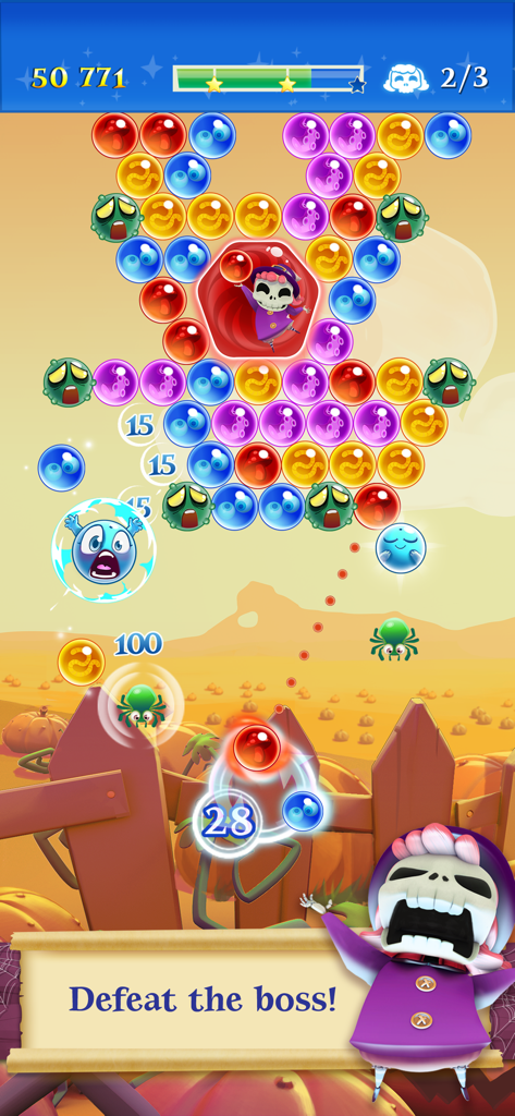 Bubble Witch 2 Saga gameplay showing a boss battle level with colorful bubbles and a skeleton character