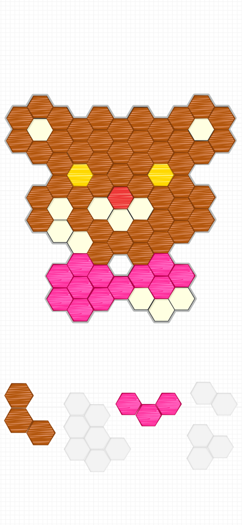 Um nível de quebra-cabeça de blocos hexagonais coloridos mostrando uma forma de urso sendo montada.