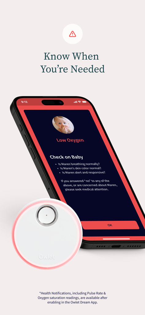 Owlet Dream - Smartphone affichant une notification d'alerte de faible taux d'oxygène sur l'application Owlet Dream avec une liste de contrôle de sécurité et une station de base rougeoyante.