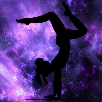 a woman doing a handstand