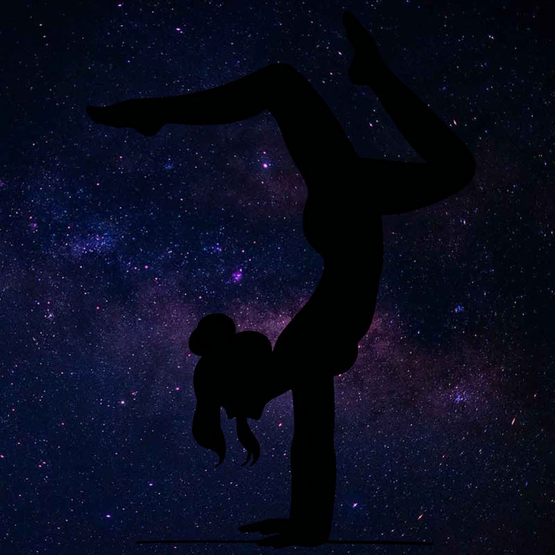 a woman doing a handstand
