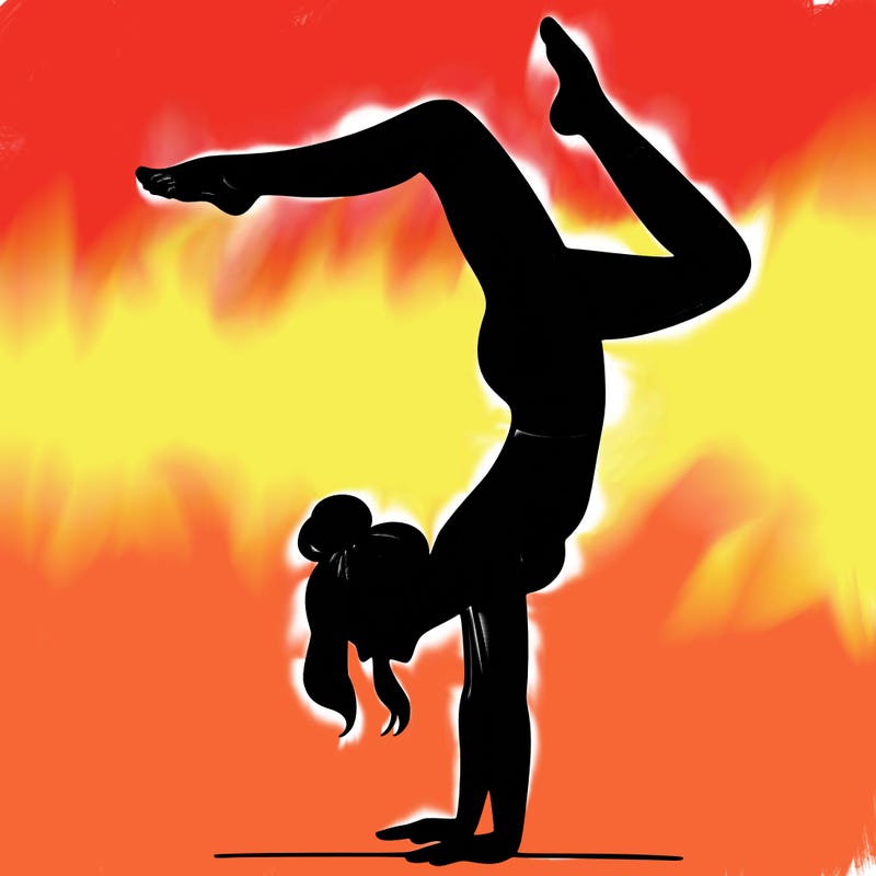 a woman doing a handstand