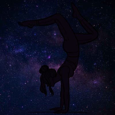 a woman doing a handstand