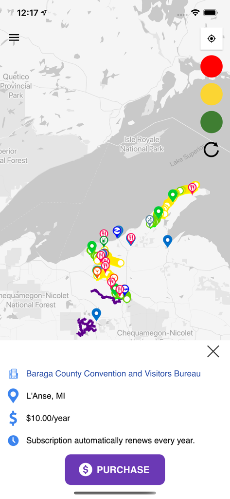 Écran de carte de l'application GroomerTracker montrant les sentiers de motoneige du Michigan avec une option d'achat pour les données de suivi des sentiers.