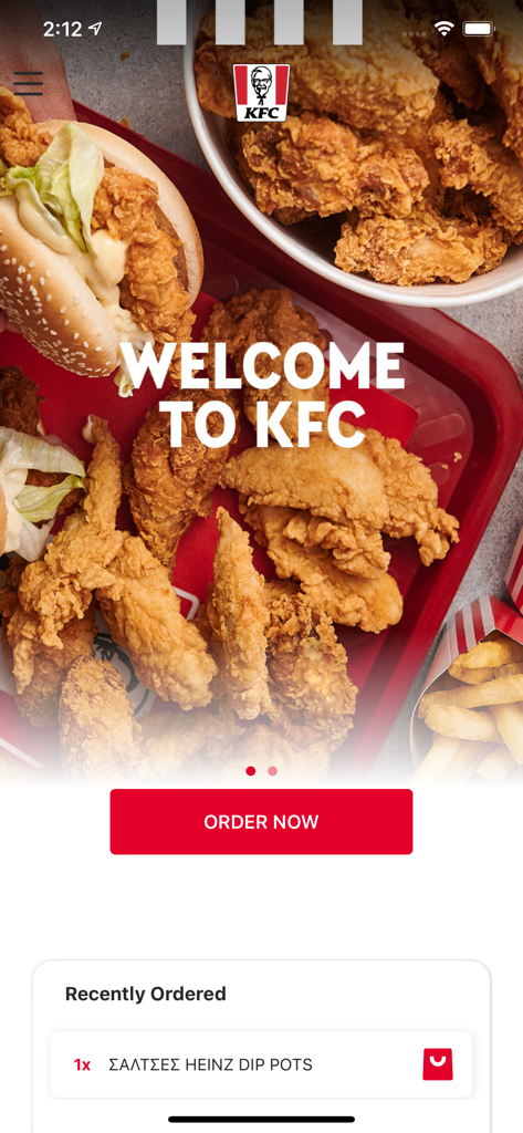 KFC Greece - Pantalla de inicio de la app móvil KFC Grecia con un mensaje de bienvenida y un botón de pedir ahora sobre un fondo de pollo frito