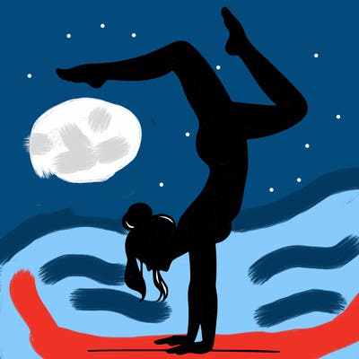 a woman doing a handstand