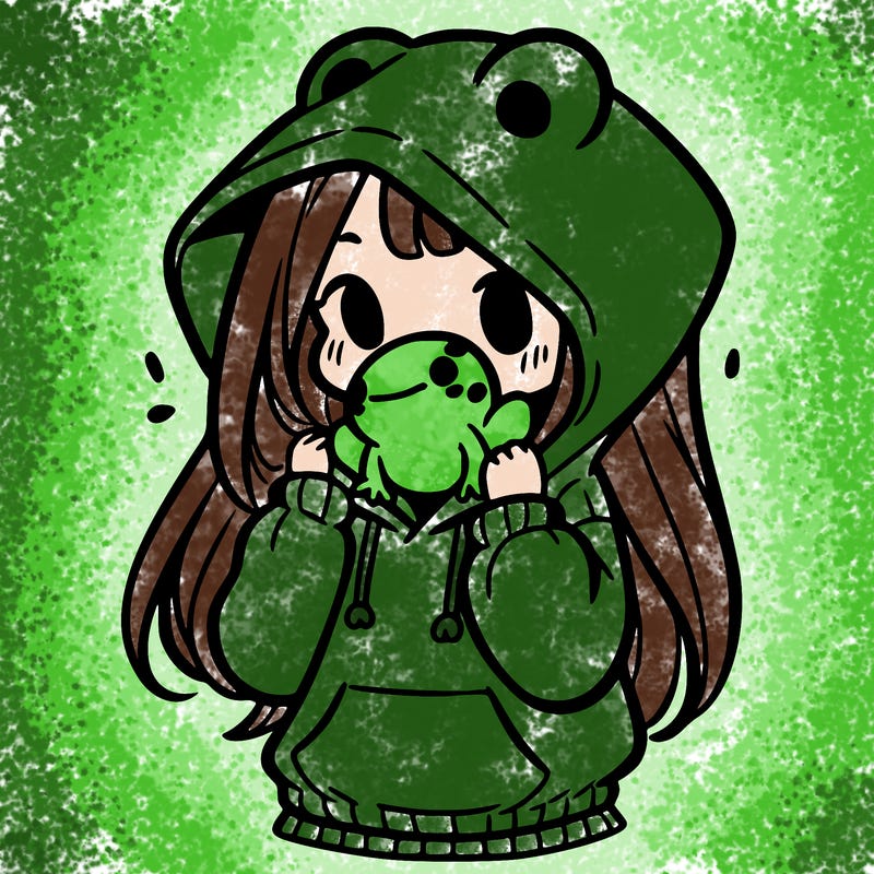 a girl holding a froggy hoodie
