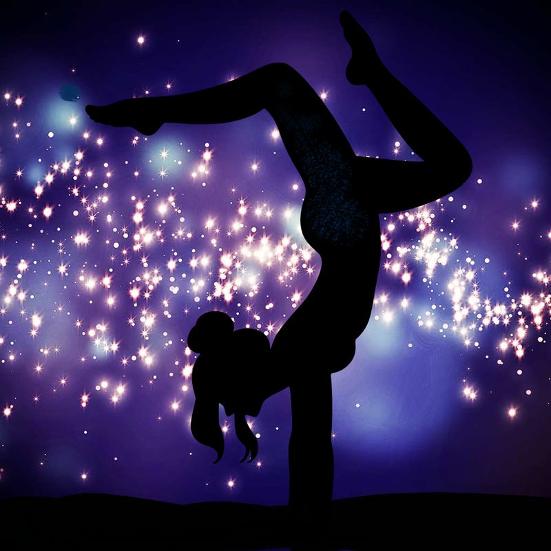 a woman doing a handstand