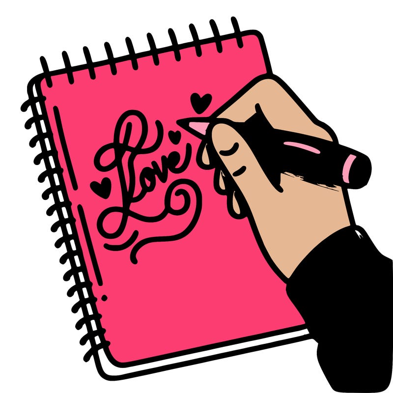 a hand writing “love” in calligraphy on a notebook