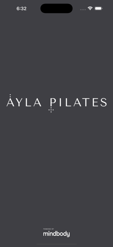 The launch screen of the Ayla Pilates mobile app featuring the studio logo and mindbody partnership text on a minimalist dark background