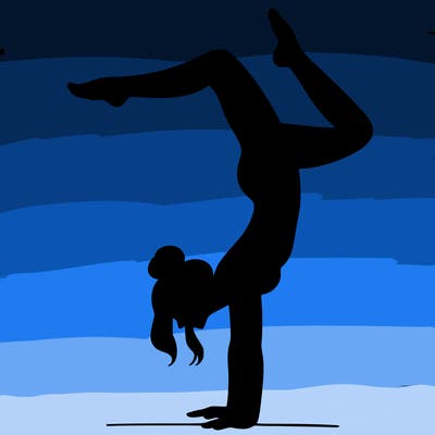 a woman doing a handstand