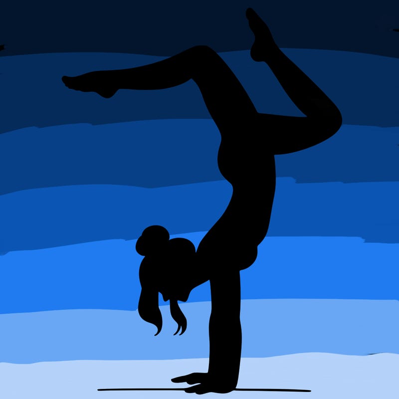 a woman doing a handstand