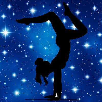 a woman doing a handstand