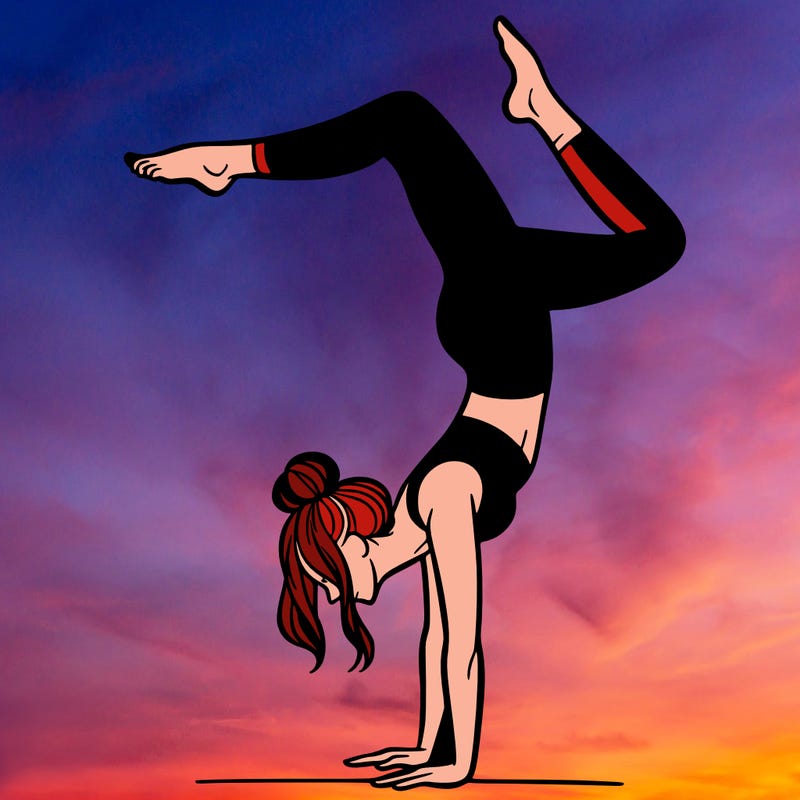 a woman doing a handstand