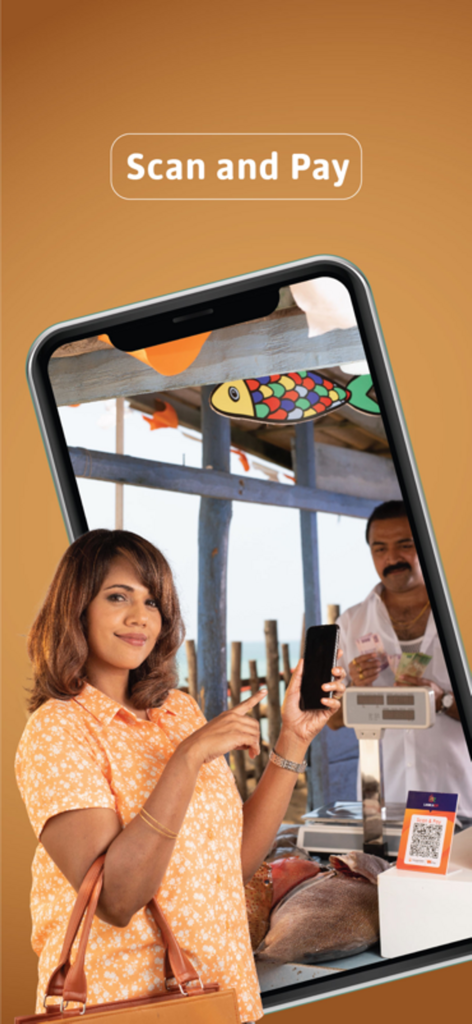 A woman using the Sampath Wepay app to scan a QR code for payment at a merchant counter