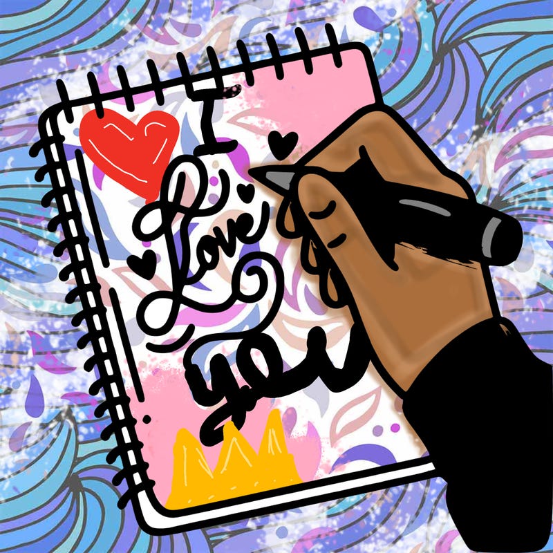 a hand writing “love” in calligraphy on a notebook