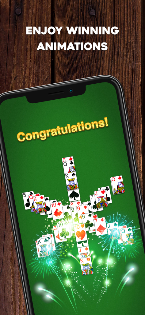 TriPeaks Solitaire: Card Game - A mobile phone displaying a victory screen in TriPeaks Solitaire with a Congratulations message and animated cards.