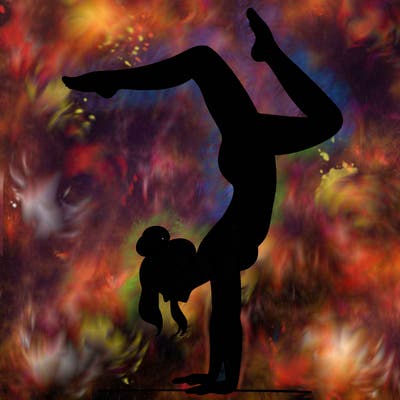 a woman doing a handstand