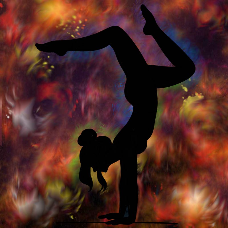 a woman doing a handstand