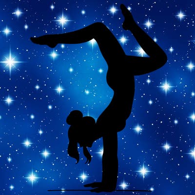 a woman doing a handstand