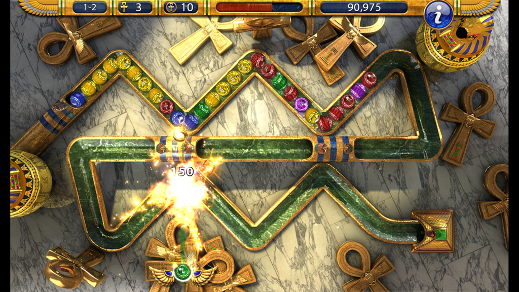 Luxor 2 - Luxor 2 gameplay screen showing colored spheres on a winding track with an Ancient Egyptian theme and a winged scarab shooter