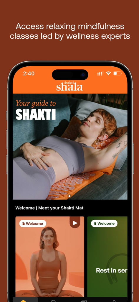 Shakti Shala - A smartphone screen displaying the Shakti Shala app home page with mindfulness classes and a woman using an acupressure mat.