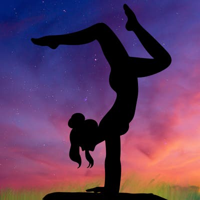 a woman doing a handstand