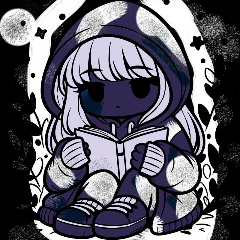 girl in oversized hoodie reading a book