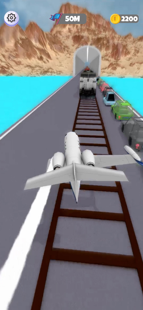 Un pequeño avión jet blanco vuela sobre una pista con vías de tren hacia un túnel en el juego Sling Plane 3D