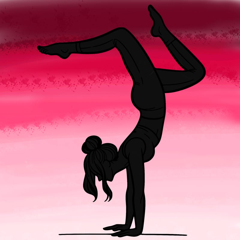 a woman doing a handstand