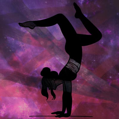 a woman doing a handstand