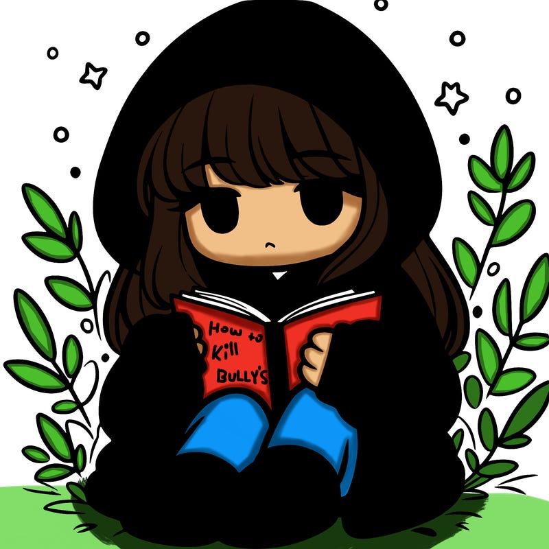 girl in oversized hoodie reading a book