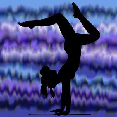 a woman doing a handstand