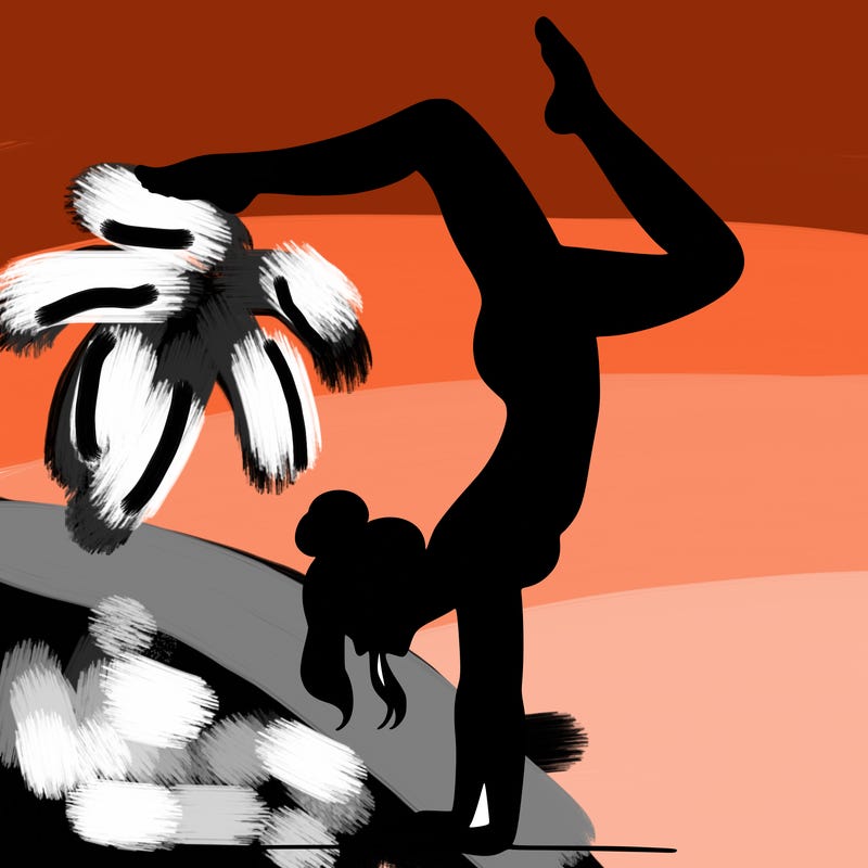 a woman doing a handstand