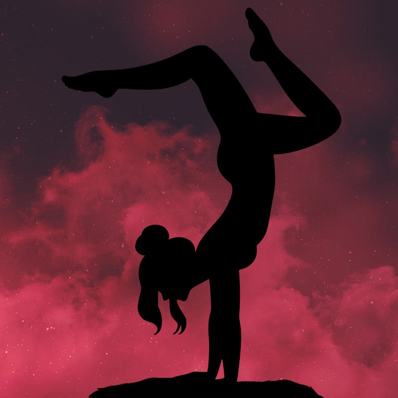 a woman doing a handstand